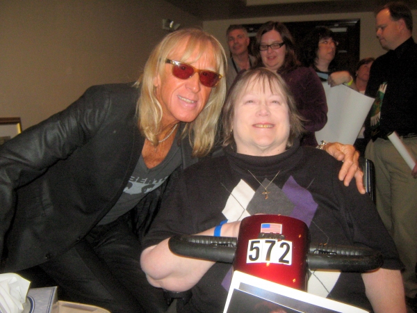 Elton John fan Jan Kemp of Chicago meets Davey Johnstone of the Elton John Band. Photo