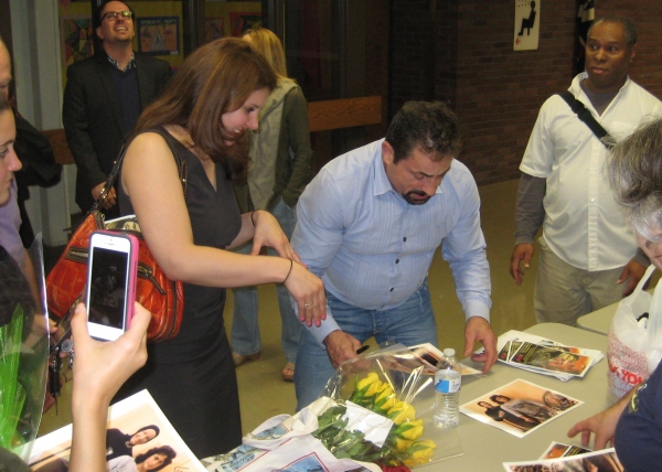 Jerry Torre signs autographs for fans in the audience Photo