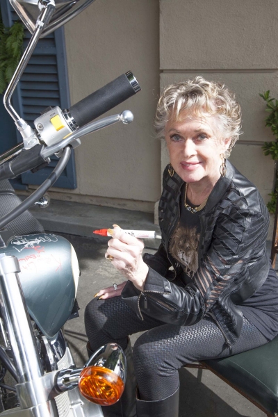 Tippi Hedren (The Birds & Marnie) signs bike Photo