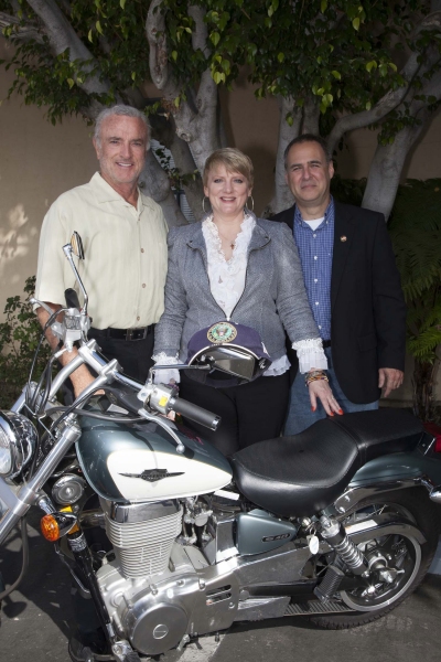 Kevin Dobson (Knotts Landing), Alison Arngrim and Greir Weeks pose with bike before s Photo