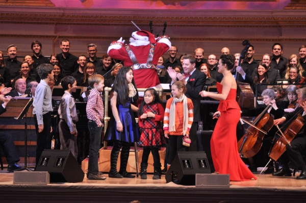 Santa Claus conducting The New York Pops with Steven Reineke and Ashley Brown Photo