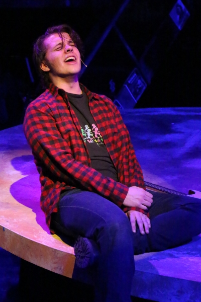 Evan Fornachon as Roger, singing ''One Song Glory'' Photo