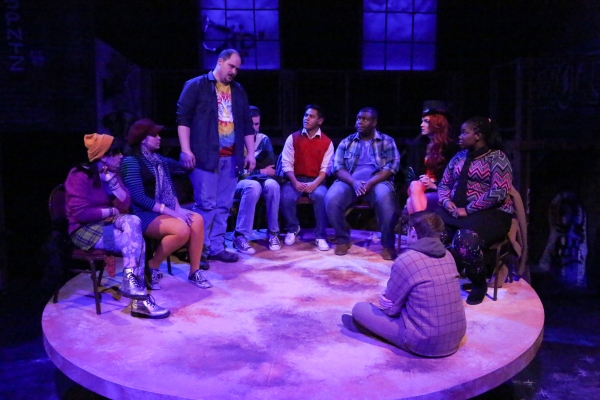 Zachary Allen Farmer (standing) and the cast, singing ''Life Support'' Photo