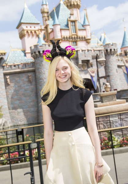 Photo Flash: MALEFICENT's Elle Fanning Visits Sleeping Beauty's Castle in Disneyland Image