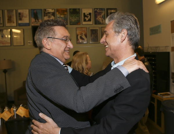 Director Moises Kaufman is congratulated by CTG Artistic Director Michael Ritchie Photo