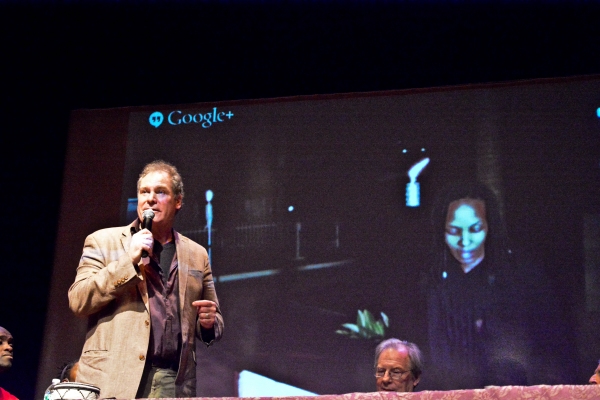 Owiso Odera, Jay O. Sanders, Hope Azeda (on screen), and Michael McKean talk between  Photo