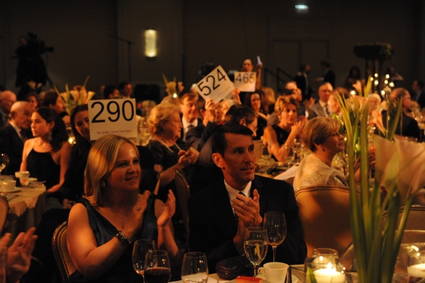 Sarah J. Nolan, left, and Bill Hinz applaud bidders during Hubbard StreetÃ¢â‚¬� Photo