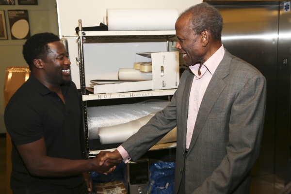 Daniel Beaty is congratulated by actor Sidney Poitier Photo