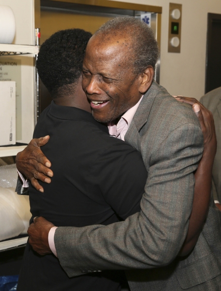 Daniel Beaty is congratulated by actor Sidney Poitier Photo