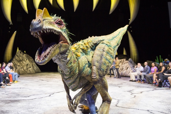 Photo Flash: WALKING WITH DINOSAURS Struts the Catwalk with 'Dinosaur Feathered Fashion Show' Image