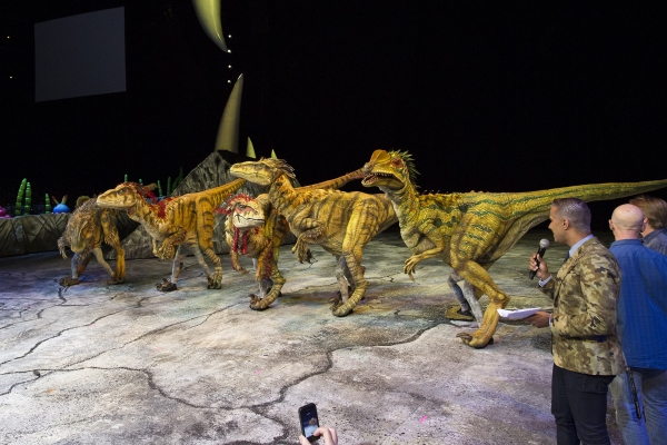 Photo Flash: WALKING WITH DINOSAURS Struts the Catwalk with 'Dinosaur Feathered Fashion Show' Image