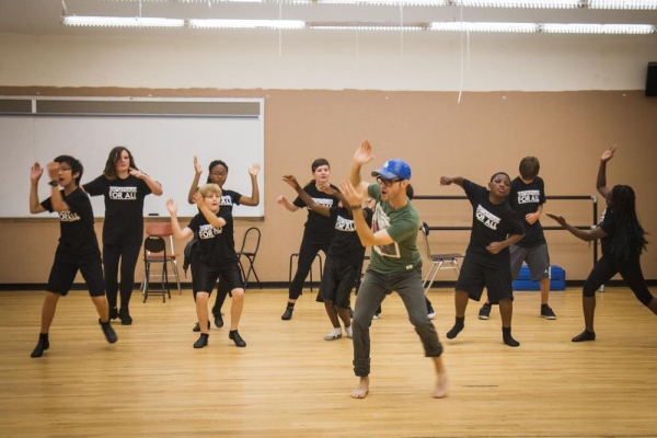 Faculty member Troy Woodcroft (Mamma Mia!) leads student artists in a dance/choreogra Photo