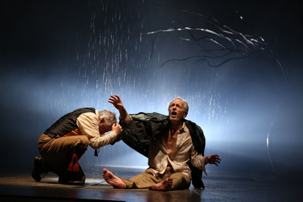 The Fool (Ross Lehman) shelters from the storm with the destitute King Lear (Larry Ya Photo