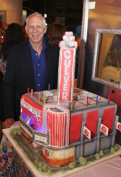 Architect Steven Ehrlich poses with the cake Photo