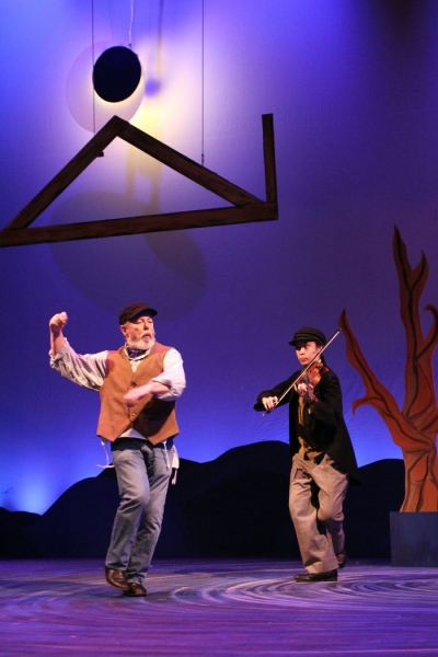 Larry Albert at Tevye and Hannah Gorham as the Fiddler Photo
