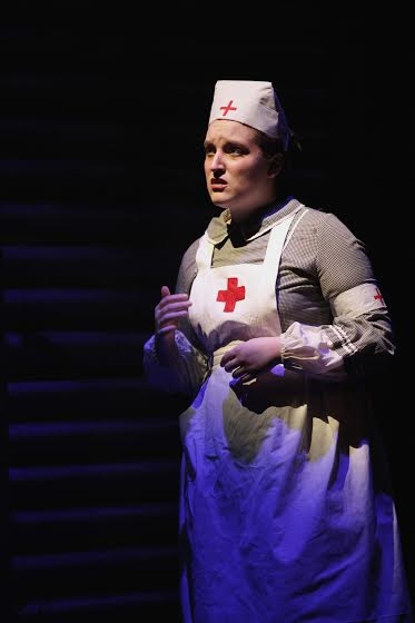 Actress Blair Godshall plays Nell, a British nurse. (Photo by Mikki Schaffner) 
 Photo