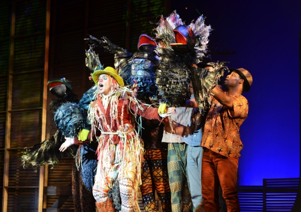 The Scarecrow (David LaMarr, center) is surrounded by crows (puppets controlled and v Photo