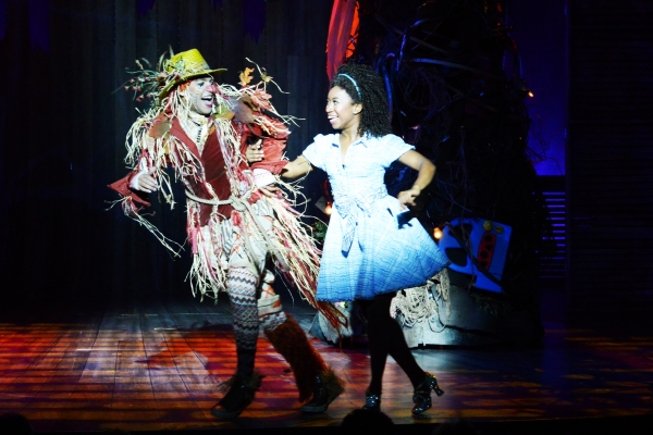 The Scarecrow (David LaMarr, left) and Dorothy (Destinee Rea, right) skip down the ye Photo