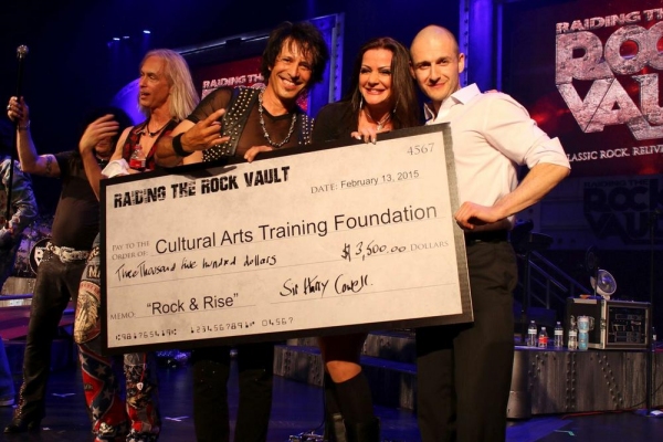 Jay Schellen and Carol-Lyn Liddle present the check to Tolerance Parvin, Executive Di Photo