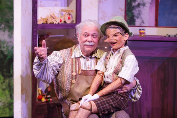Geppetto (Nicholas F. Saverine) gets to know his new son Pinocchio (Topher Cundith). Photo