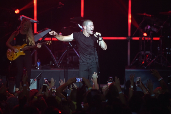 Photo Flash: Nick Jonas and Demi Lovato Take the Stage for MTV's VMA Benefit Concert Image