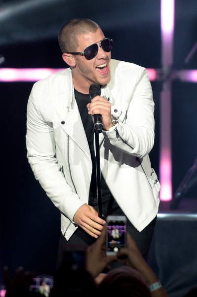 Photo Flash: Nick Jonas and Demi Lovato Take the Stage for MTV's VMA Benefit Concert Image