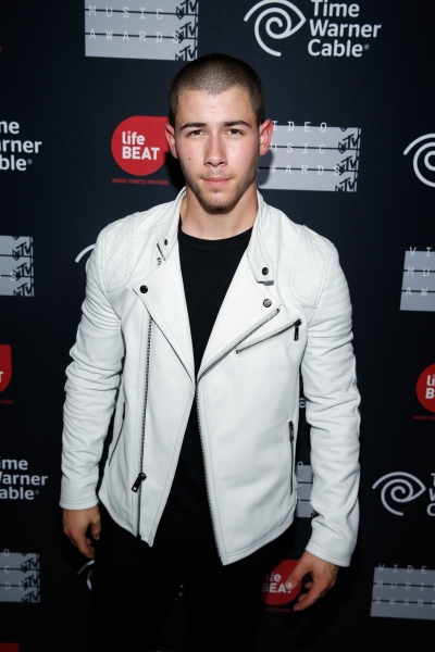 Photo Flash: Nick Jonas and Demi Lovato Take the Stage for MTV's VMA Benefit Concert 