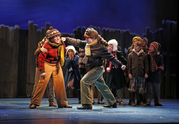 Town bully Scut Farkus (Reid Patrick Tomasson, right) takes a swing at Ralphie, (Mich Photo