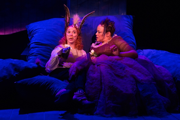 Bottom (Holly Twyford, left) finds herself in a fantastical situation, lying beside T Photo