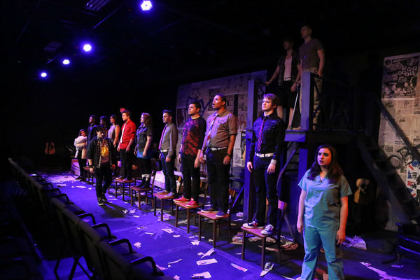 Evan Fornachon as Johnny (in front) with the cast of New Line Theatre''s AMERICAN IDI Photo