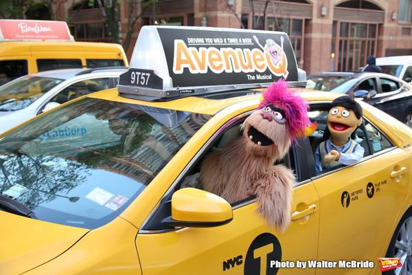   Trekkie Monster drives a New York City 'Avenue Q'  Taxi with Princeton as his passe Photo