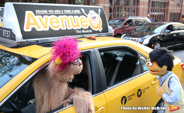   Trekkie Monster drives a New York City 'Avenue Q'  Taxi with Princeton as his passe Photo