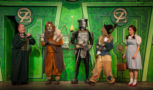 The Gatekeeper (Alan Payne) tells The Lion (Brian C. Rosenthal), The Tin Man (Matt Re Photo