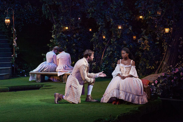 Kieran Campion as Berowne and Pascale Armand as Rosaline (foreground) with Kristen Co Photo