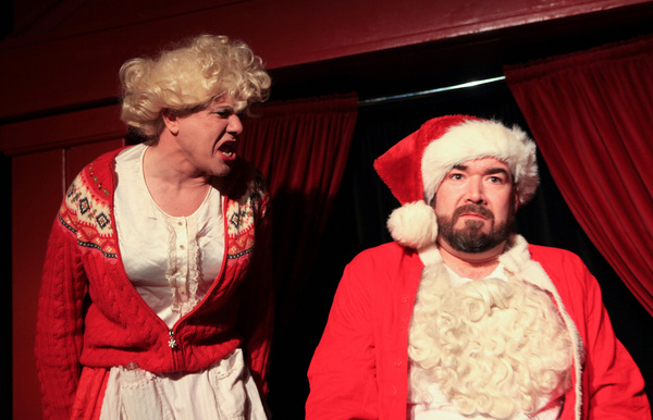 (left to right) Mrs. Claus (Ed Jones) tries to talk to an unresponsive Santa (Michael Photo