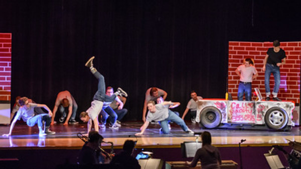 The Male Ensemble featuring Ben Rico as Sonny. Photo