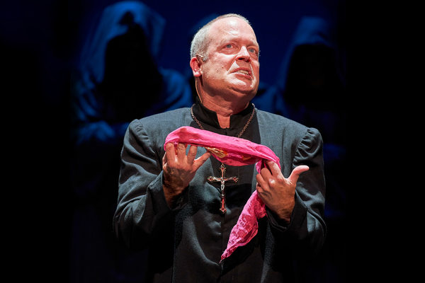 Dom Claude Frollo (Tom Ford*) struggles with newfound temptation. Photo