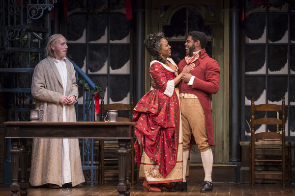 Larry Yando (Ebenezer Scrooge), Penelope Walker (Mrs. Fezziwig) and Breon Arzell (Dic Photo