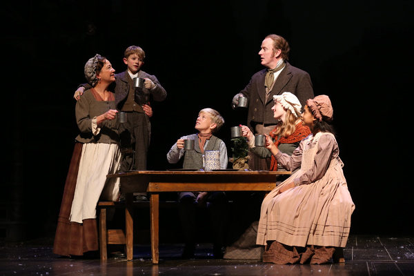 Amy McWilliams as Mrs. Cratchit, Malcom Fuller as Tiny Tim, Tad Clifton as Peter Crat Photo