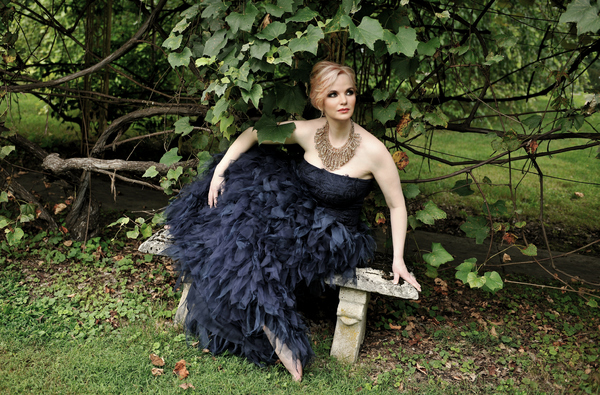 Doreen Taylor sits beneath an arbor at the former Pennsylvania home of Oscar Hammerst Photo