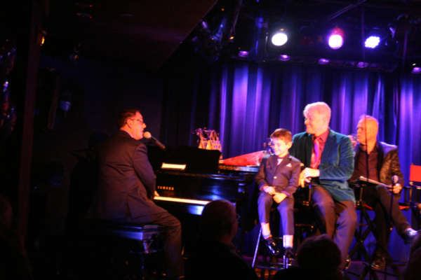 Michael Masci sings as his son, Richard, and Russ look-on.  Photo