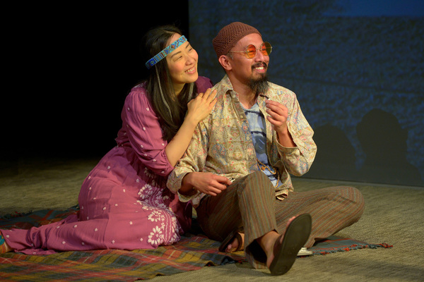 Two hippies (Cindy Im, left, and Jomar Tagatac) smoke a joint Photo