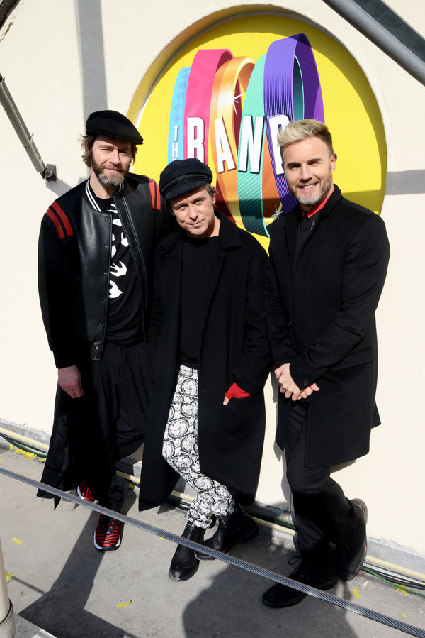 Howard Donald, Mark Owen and Gary Barlow of Take That pose on the roof of The Theatre Photo