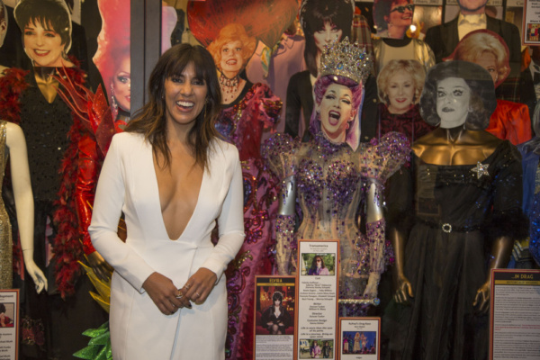 Honoree Stephanie Beatriz with costumes on display worn by LGBTQ Icons and Legends Photo