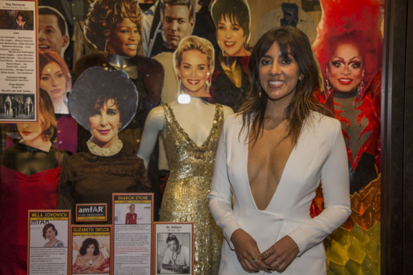 Honoree Stephanie Beatriz with costumes on display worn by LGBTQ Icons and Legends Photo