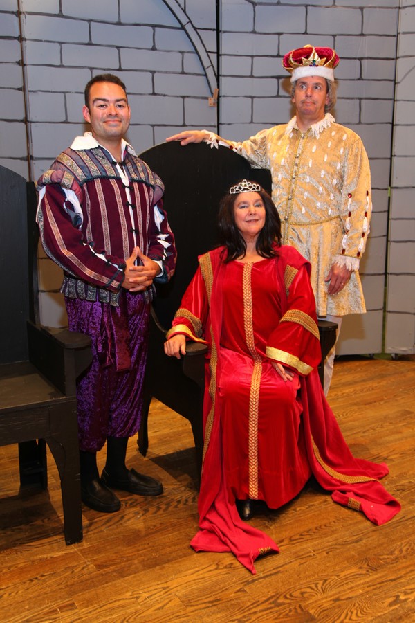 Eric Mansilla, Sara Zentmeyer (seated), and John Mallonee as Prince Dauntless, Queen  Photo