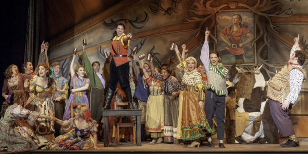 John Detty (Gaston) center and Lefou (far R) with the cast of Beauty & the Beast Photo