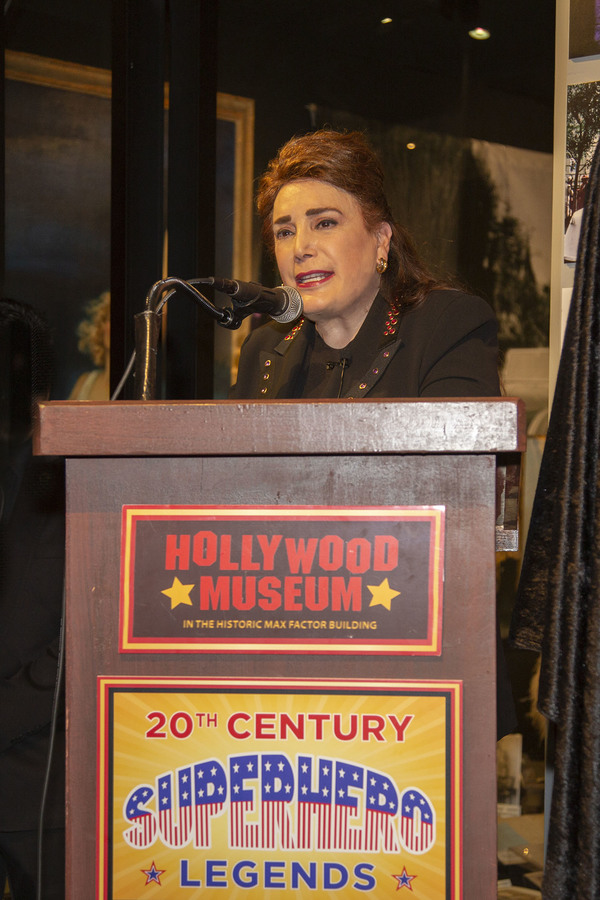 Hollywood Museum Founder/President, Donelle Dadigan welcomes guests at Podium Photo