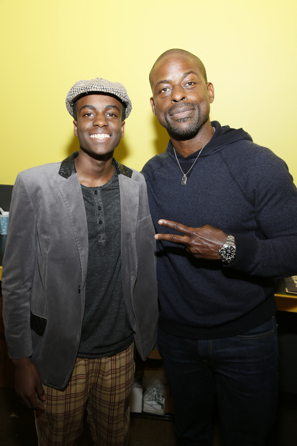 From left, first place winner Dejean Deterville and celebrity judge Sterling K. Brown Photo