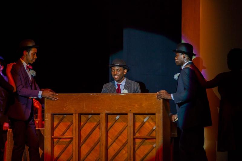 Max Fonrose (center) and members of the company of Ragtime.